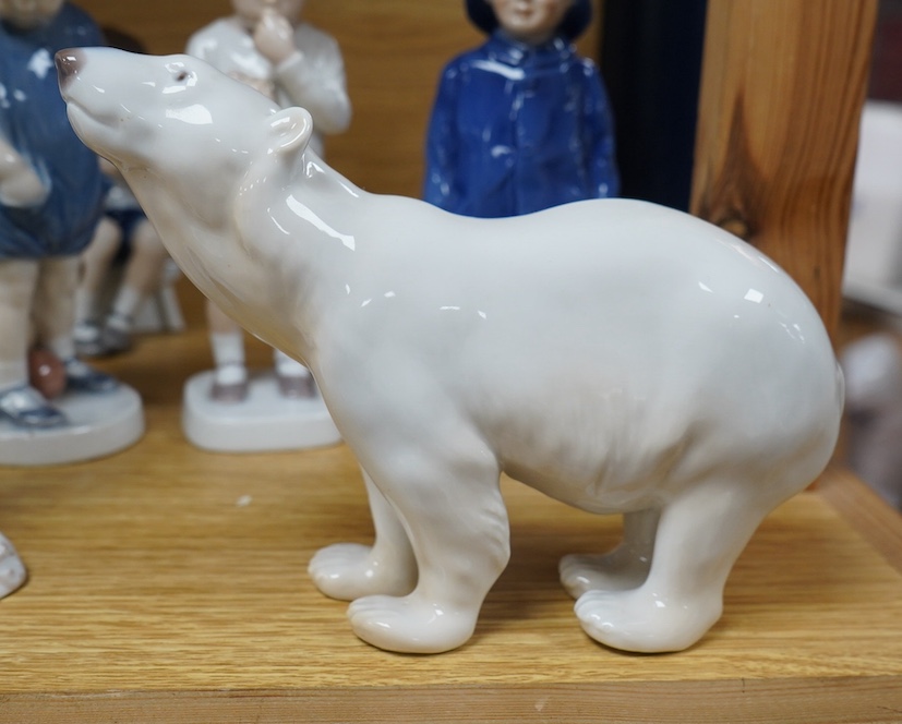 Six Royal Copenhagen or B & G figures of children and a polar bear, tallest 19.5cm. Condition - good.